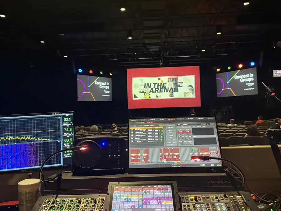 Front-of-house audio and video control position facing an event stage