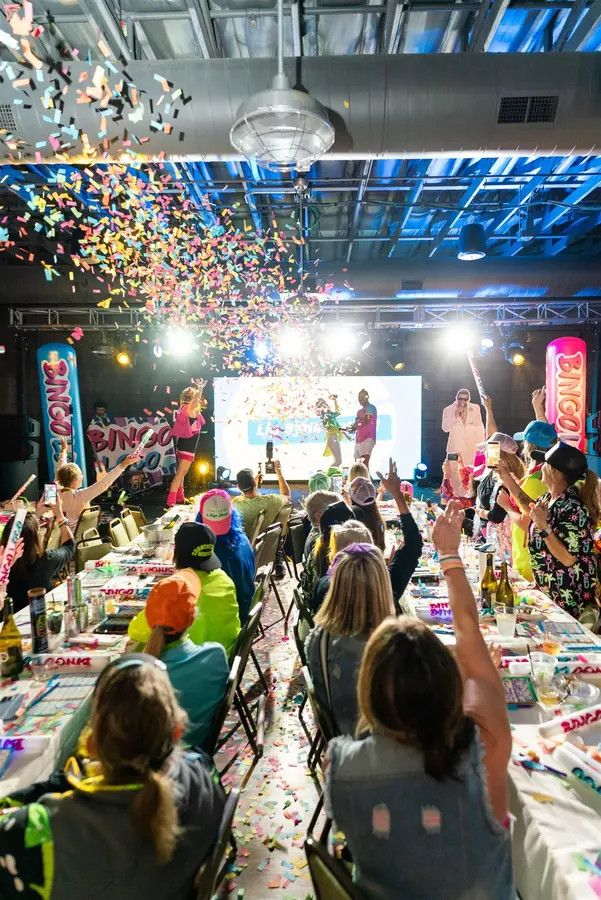 Colorful event lighting and confetti energizing a live show