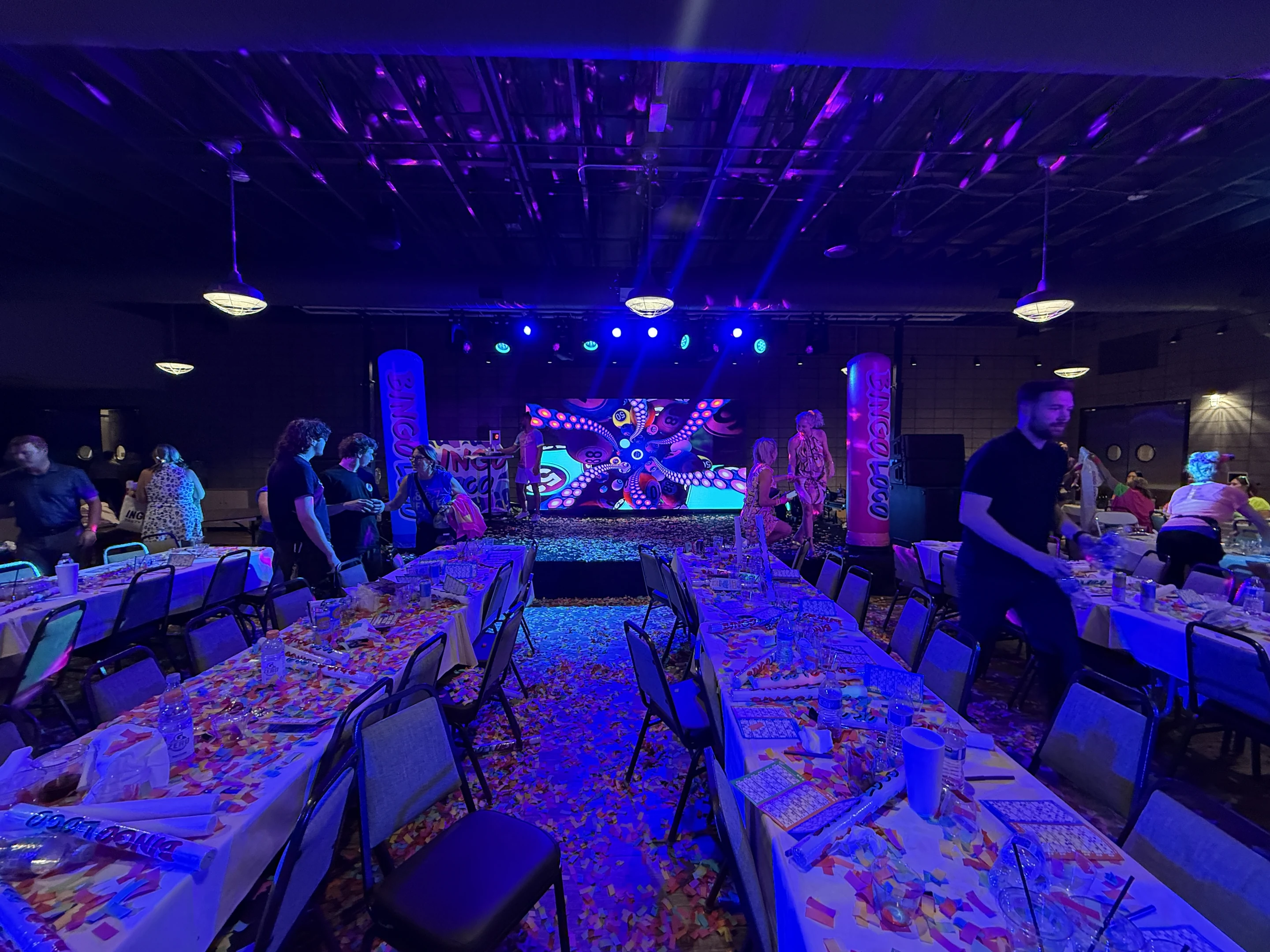 Audience facing a large LED screen at a Bingo Loco live event